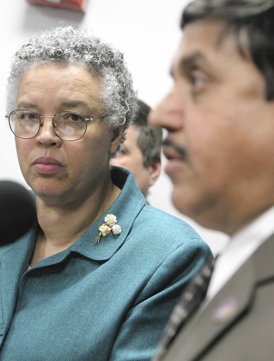 Cook County board president Toni Preckwinkle looks on as CEO Cook County Health and Hospitals Systems, Dr. Ram Raju speaks during a news conference, Monday, April 2, 2012, to announce plans for a sweeping worksite wellness program that will engage Cook County’s 22,000 employees in healthy lifestyle programs. (Antonio Perez/Chicago Tribune)