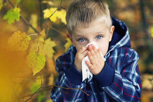 Little boy having autumn cold