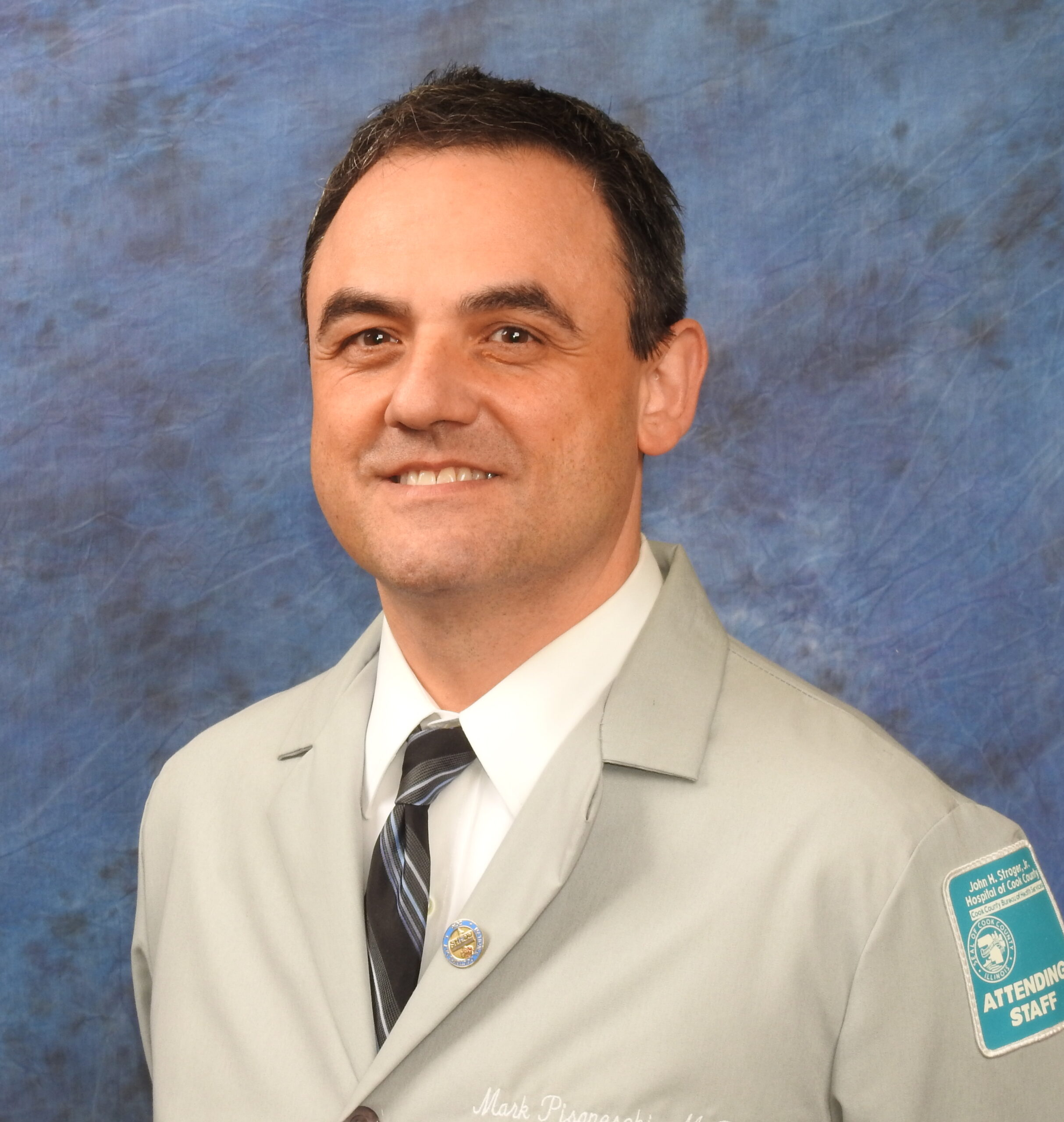 Dr. Mark J. Pisaneschi